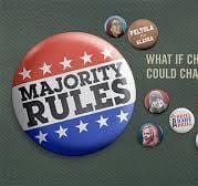 A large button with the words "Majority Rules" in red, white, and blue, surrounded by smaller pins with various faces and text on a dark background.